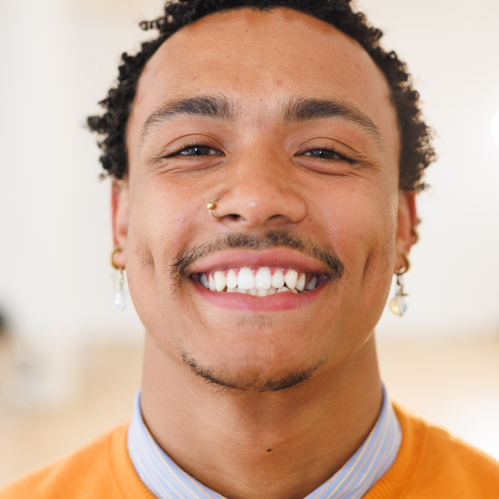 close-up of a young male, smiling, looking at the camera after getting composite bonding in Oadby