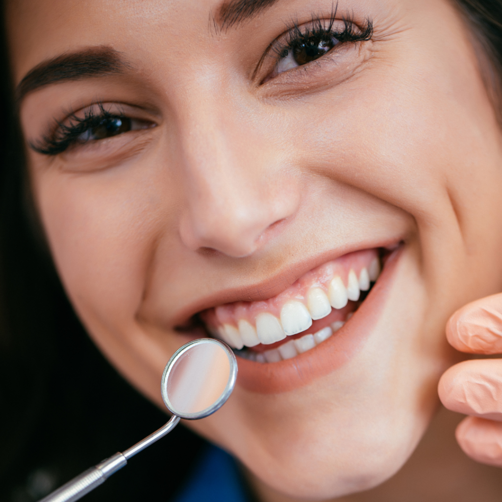 Dental crowns in Leicester at Smile Perfections dentist Leicester, featuring a girl smiling confidently after receiving natural-looking tooth restorations.