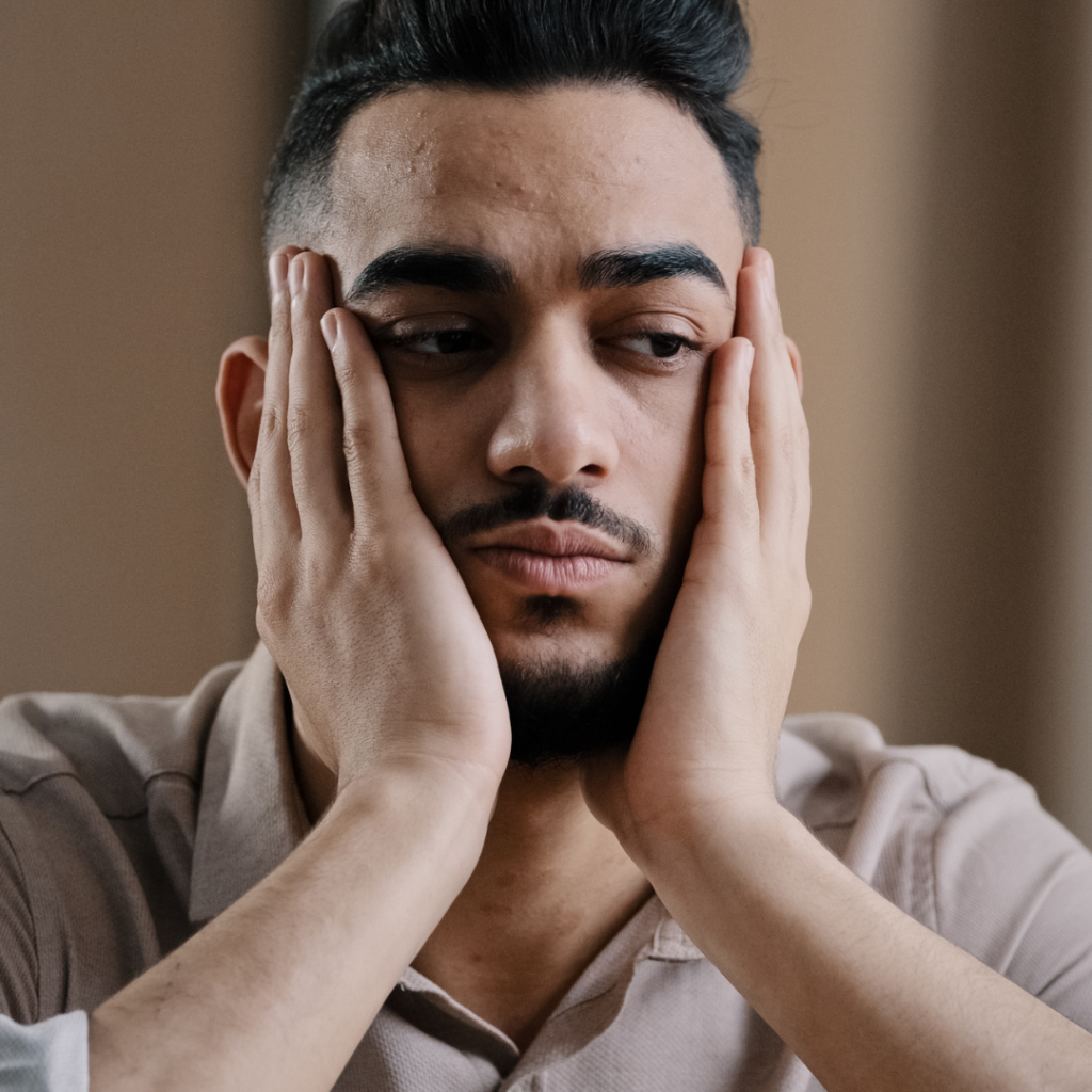 Man showing nervousness at Smile Perfections dentist Leicester, representing patients experiencing dental anxiety and the practice’s supportive care approach.
