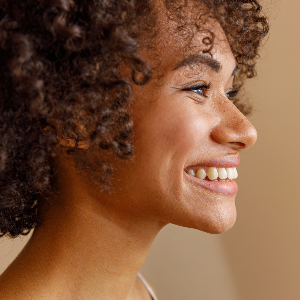 Smile makeovers in Leicester at Smile Perfections dentist Leicester, featuring a girl smiling confidently after receiving personalised cosmetic dental treatment.