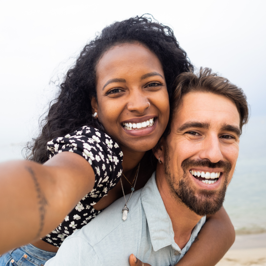 Smile makeovers in Leicester at Smile Perfections dentist Leicester, showing a couple smiling happily after successful cosmetic dental treatments.