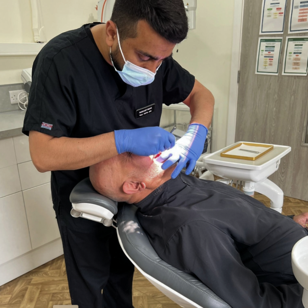 Smile makeovers in Leicester at Smile Perfections dentist Leicester, showing a dentist consulting with a patient to discuss personalised cosmetic dental treatment options.