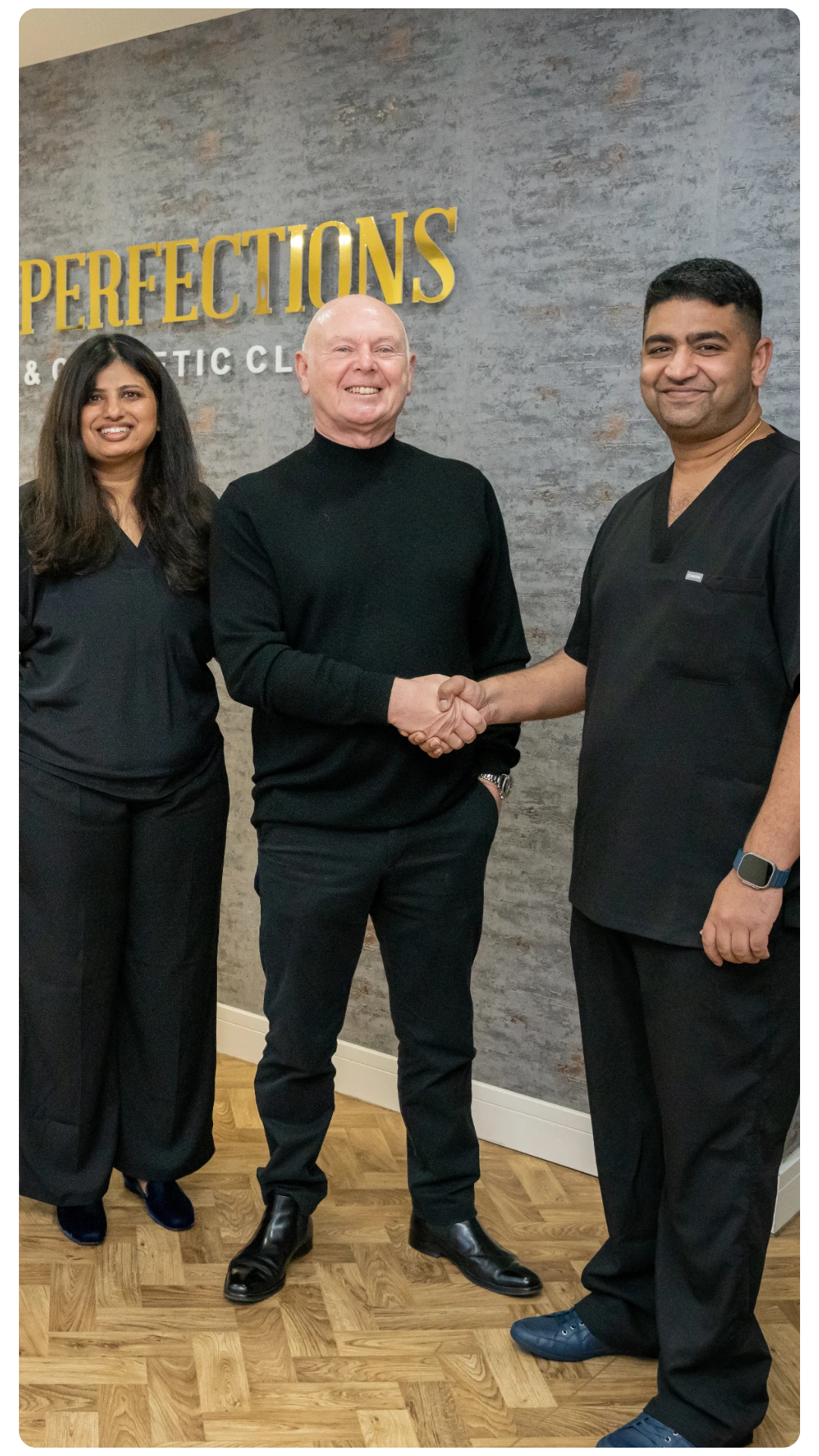 Dr Juttes Pallipatt and Dr Pratima Pallipatt at Smile Perfections in Leicester shaking hands with a patient, all three smiling after a positive treatment experience.