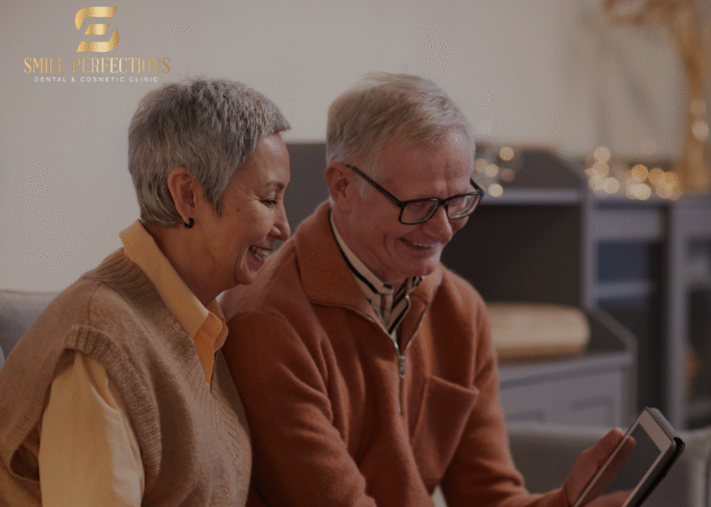 complete mouth dental implants - elderly couple navigating Smile Perfections website to choose their implant option